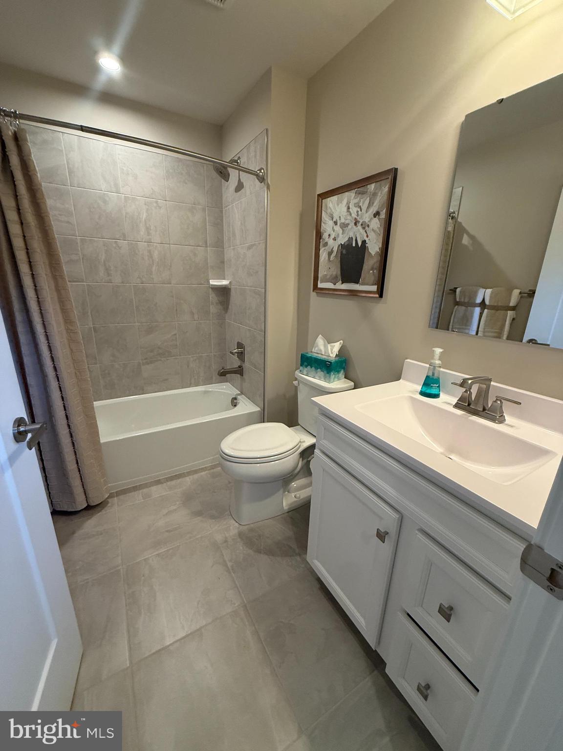 2506 Crown Point Circle Frederick, MD 21702 - Photo 17 of 21 a bathroom with a granite countertop sink toilet and shower