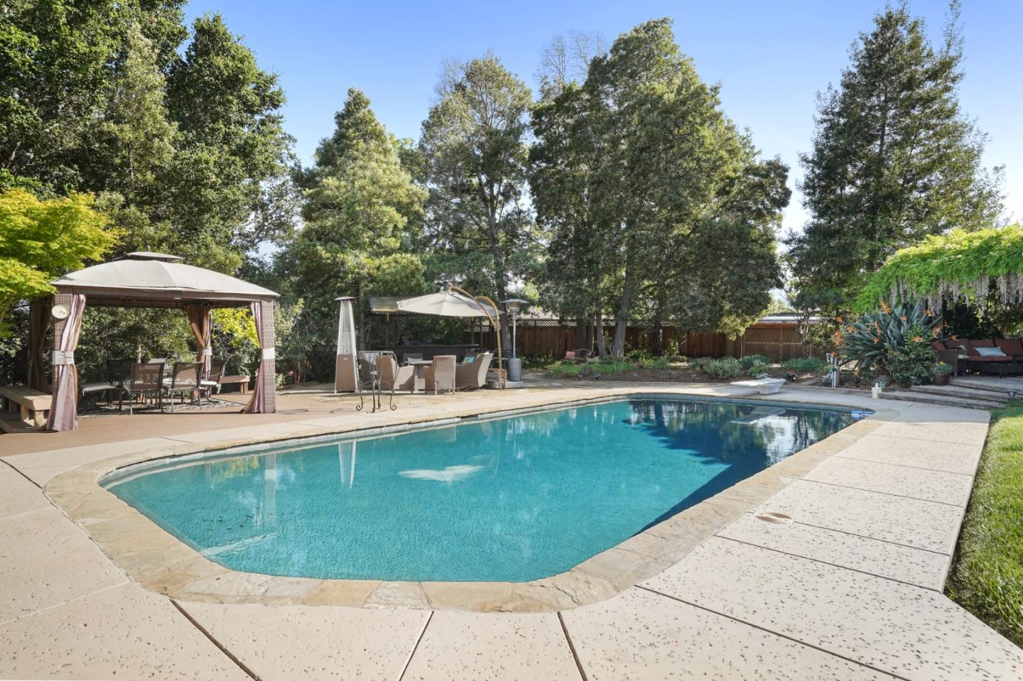 14160 Miranda Road Los Altos Hills, CA 94022 - Photo 18 of 30 a view of a swimming pool with sitting area