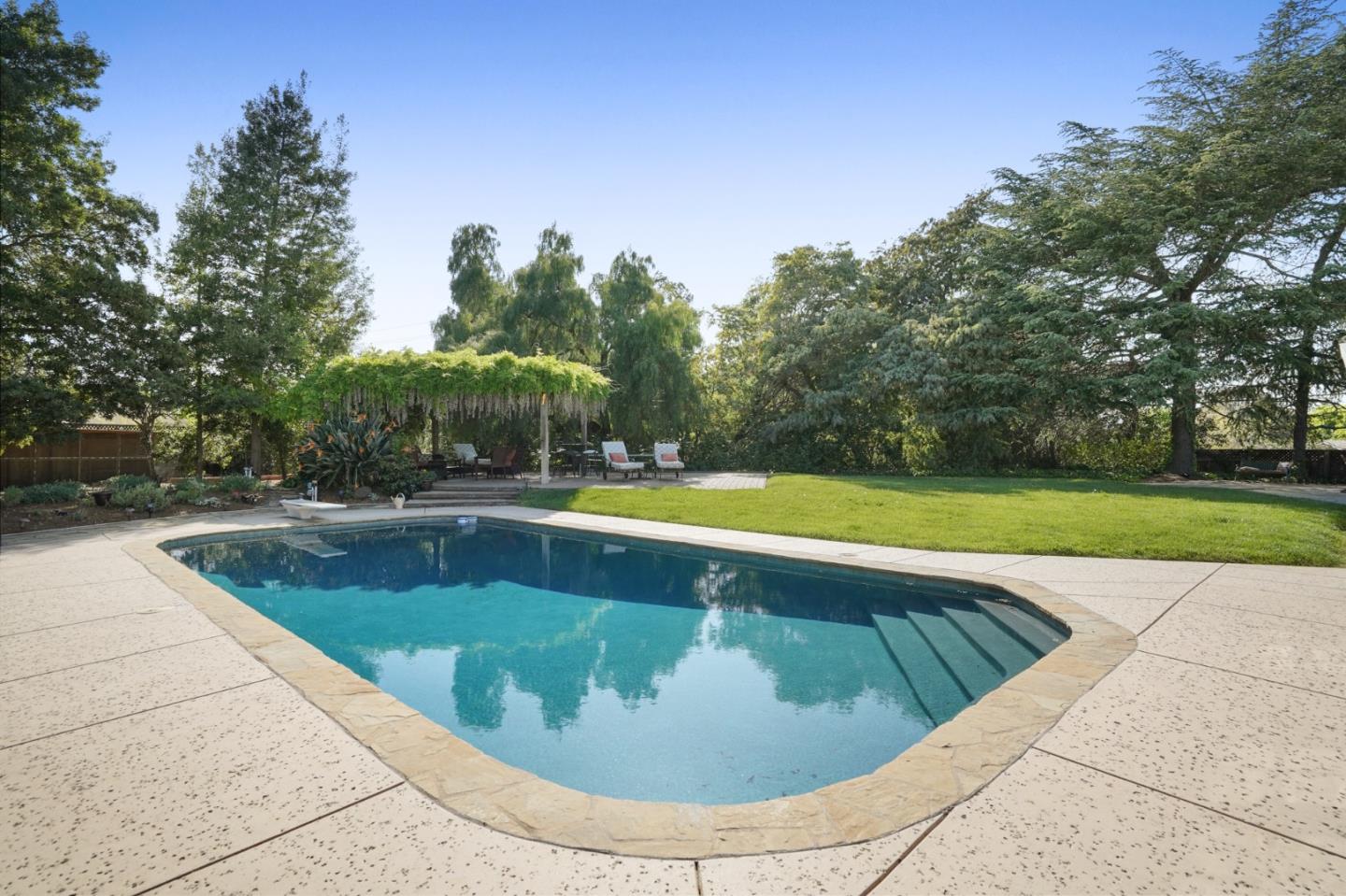 14160 Miranda Road Los Altos Hills, CA 94022 - Photo 19 of 30 a view of a swimming pool with a yard