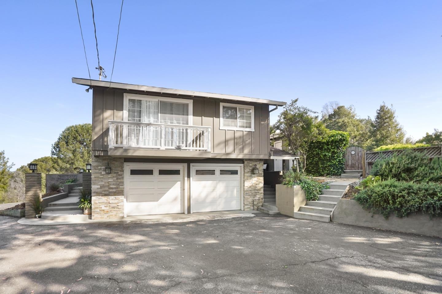 14160 Miranda Road Los Altos Hills, CA 94022 - Photo 4 of 30 a front view of a house with a garage