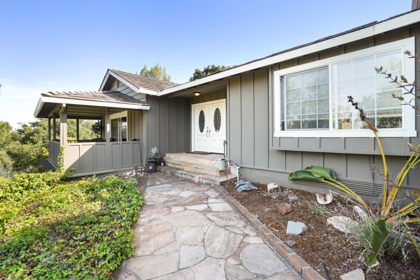 14160 Miranda Road Los Altos Hills, CA 94022 - Photo 5 of 30 a front view of a house with garden