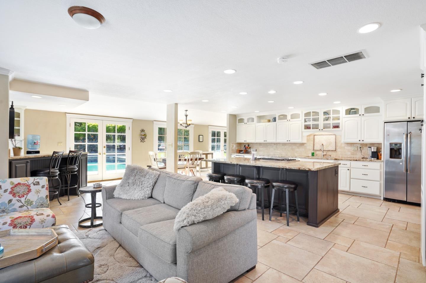 14160 Miranda Road Los Altos Hills, CA 94022 - Photo 7 of 30 a living room with furniture and a kitchen view