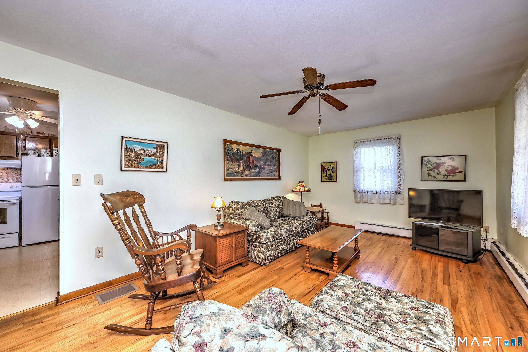 212 Swain Avenue Meriden, CT 06450 - Photo 14 of 38 a living room with furniture and a wooden floor
