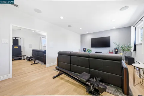 a view of hallway with livingroom and furniture
