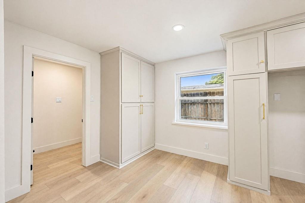 1904 Apollo Road Richardson, TX 75081 - Photo 10 of 40 Light wood-finish flooring with white baseboards