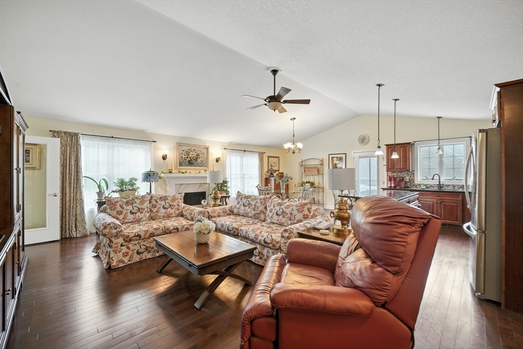 46 Palmer Road, Unit 28 Monson, MA 01057 - Photo 12 of 38 a living room with furniture or wooden floor and a chandelier