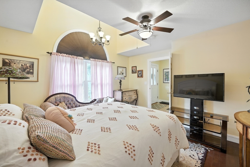 46 Palmer Road, Unit 28 Monson, MA 01057 - Photo 16 of 38 a bedroom with a bed and a flat screen tv