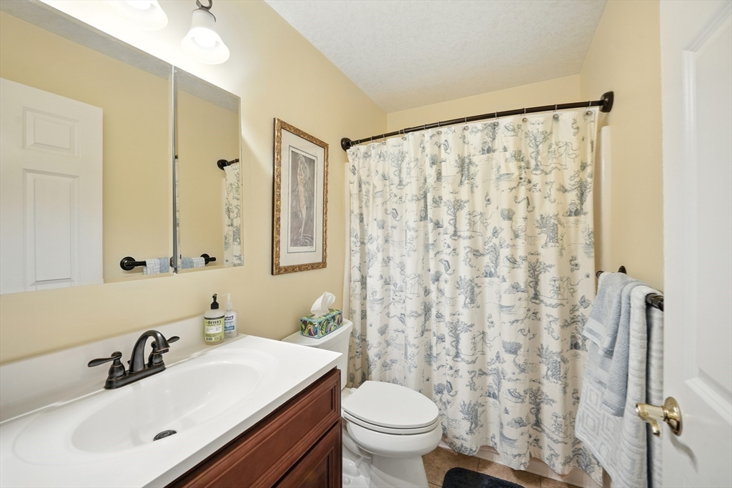 46 Palmer Road, Unit 28 Monson, MA 01057 - Photo 17 of 38 a bathroom with a sink and a mirror