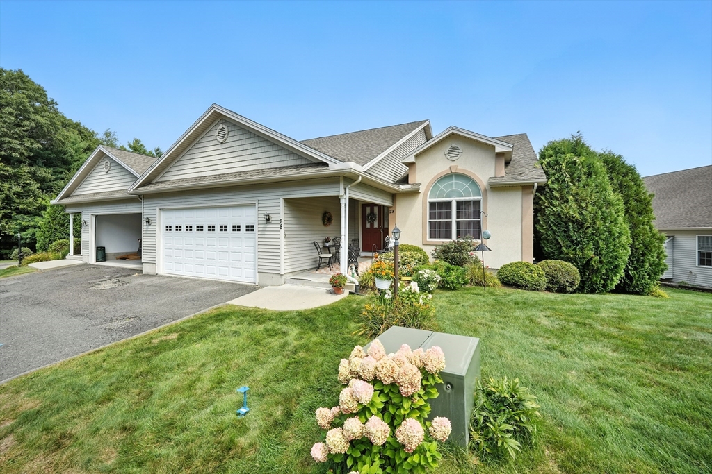 46 Palmer Road, Unit 28 Monson, MA 01057 - Photo 2 of 38 a front view of a house with garden