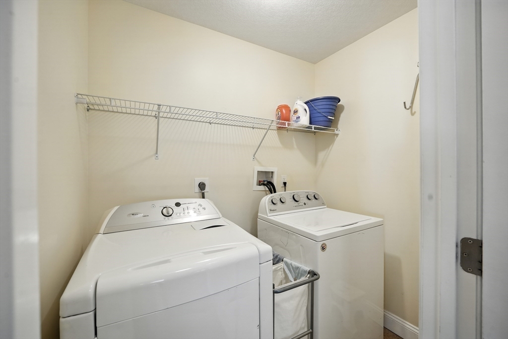 46 Palmer Road, Unit 28 Monson, MA 01057 - Photo 25 of 38 a utility room with dryer and washer