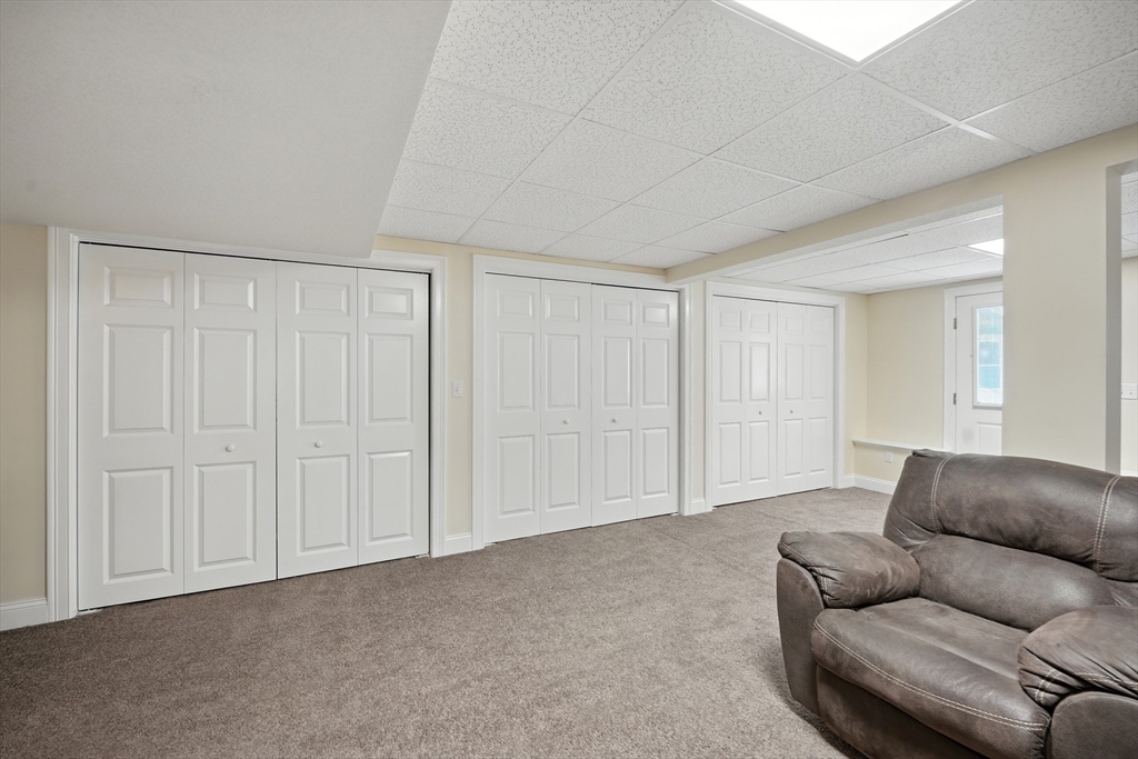 46 Palmer Road, Unit 28 Monson, MA 01057 - Photo 26 of 38 a living room with furniture and a white door