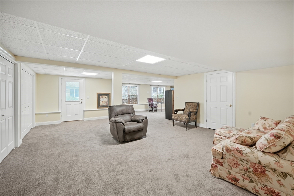 46 Palmer Road, Unit 28 Monson, MA 01057 - Photo 27 of 38 a living room with furniture and a large window