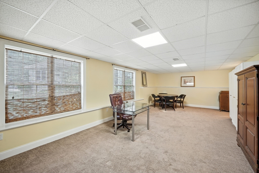 46 Palmer Road, Unit 28 Monson, MA 01057 - Photo 29 of 38 a view of a livingroom with furniture and a gate