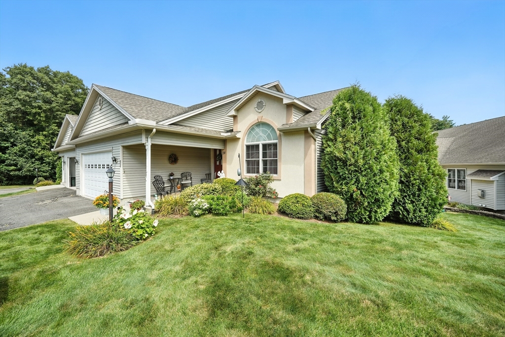 46 Palmer Road, Unit 28 Monson, MA 01057 - Photo 3 of 38 a front view of house with yard and green space