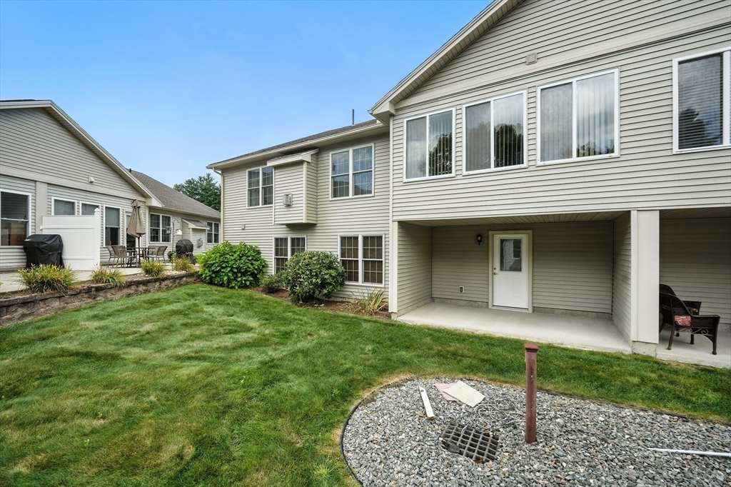 46 Palmer Road, Unit 28 Monson, MA 01057 - Photo 34 of 38 a front view of a house with a yard and porch