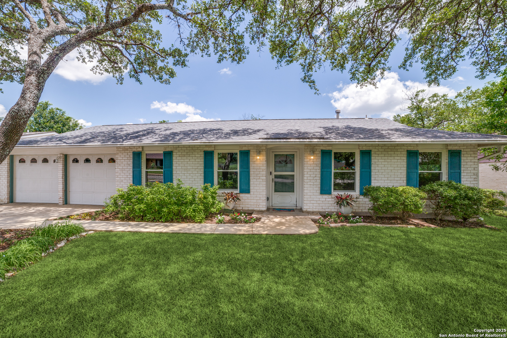 a front view of house with yard and green space