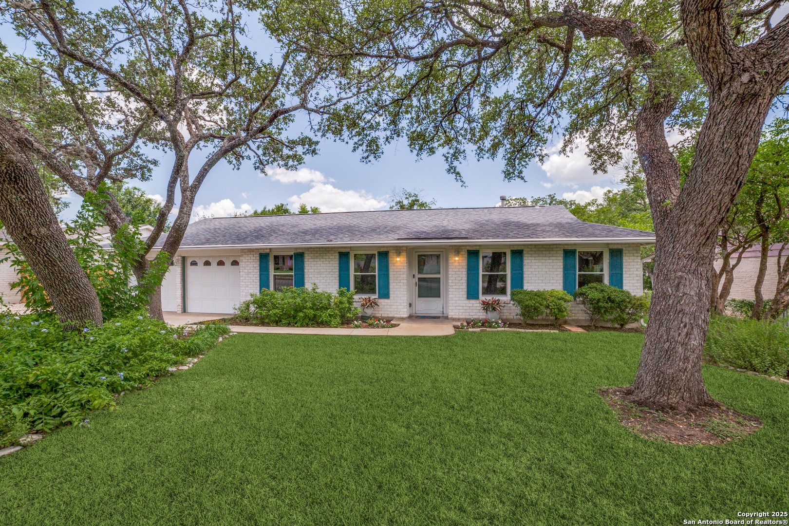 3323 Old Forge San Antonio, TX 78230 - Photo 2 of 26 a front view of a house with garden and porch