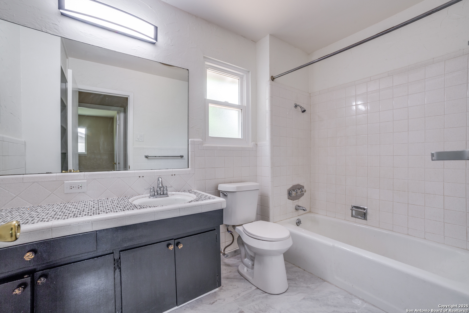 3323 Old Forge San Antonio, TX 78230 - Photo 23 of 26 a bathroom with a sink a toilet and a bathtub