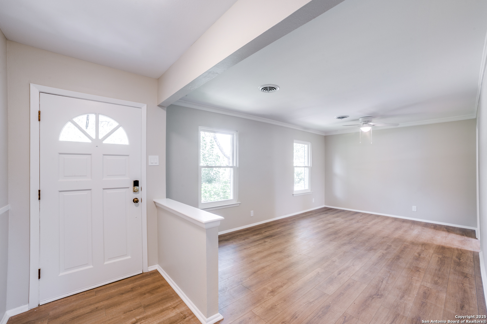 3323 Old Forge San Antonio, TX 78230 - Photo 5 of 26 an empty room with wooden floor and windows