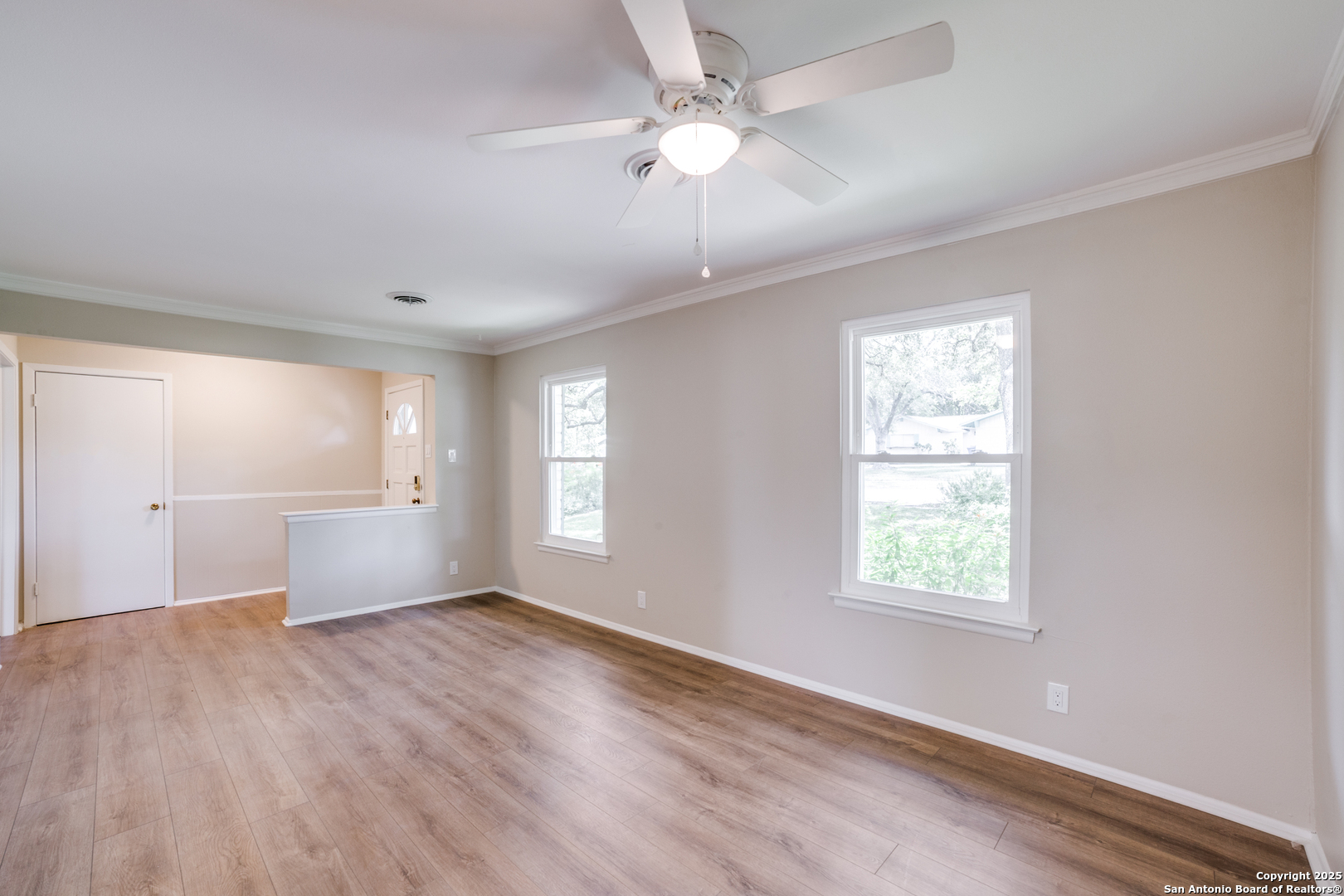 3323 Old Forge San Antonio, TX 78230 - Photo 6 of 26 wooden floor in an empty room with a window