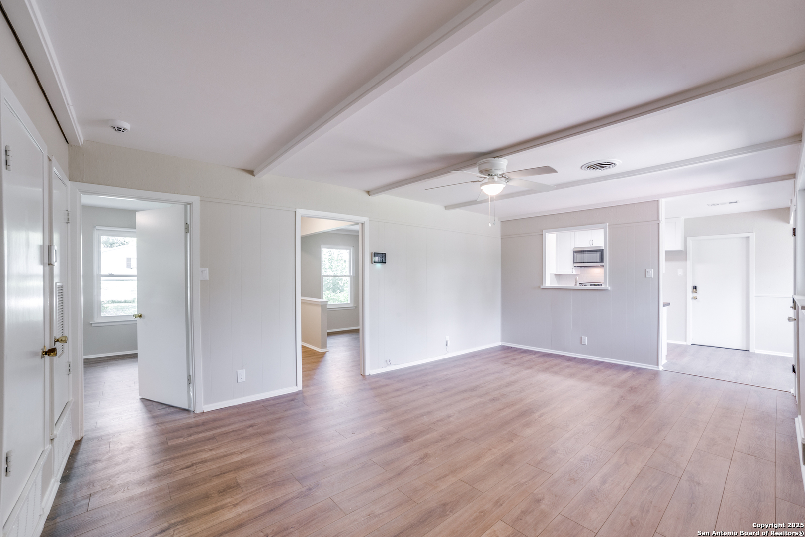 3323 Old Forge San Antonio, TX 78230 - Photo 8 of 26 a view of an empty room with wooden floor