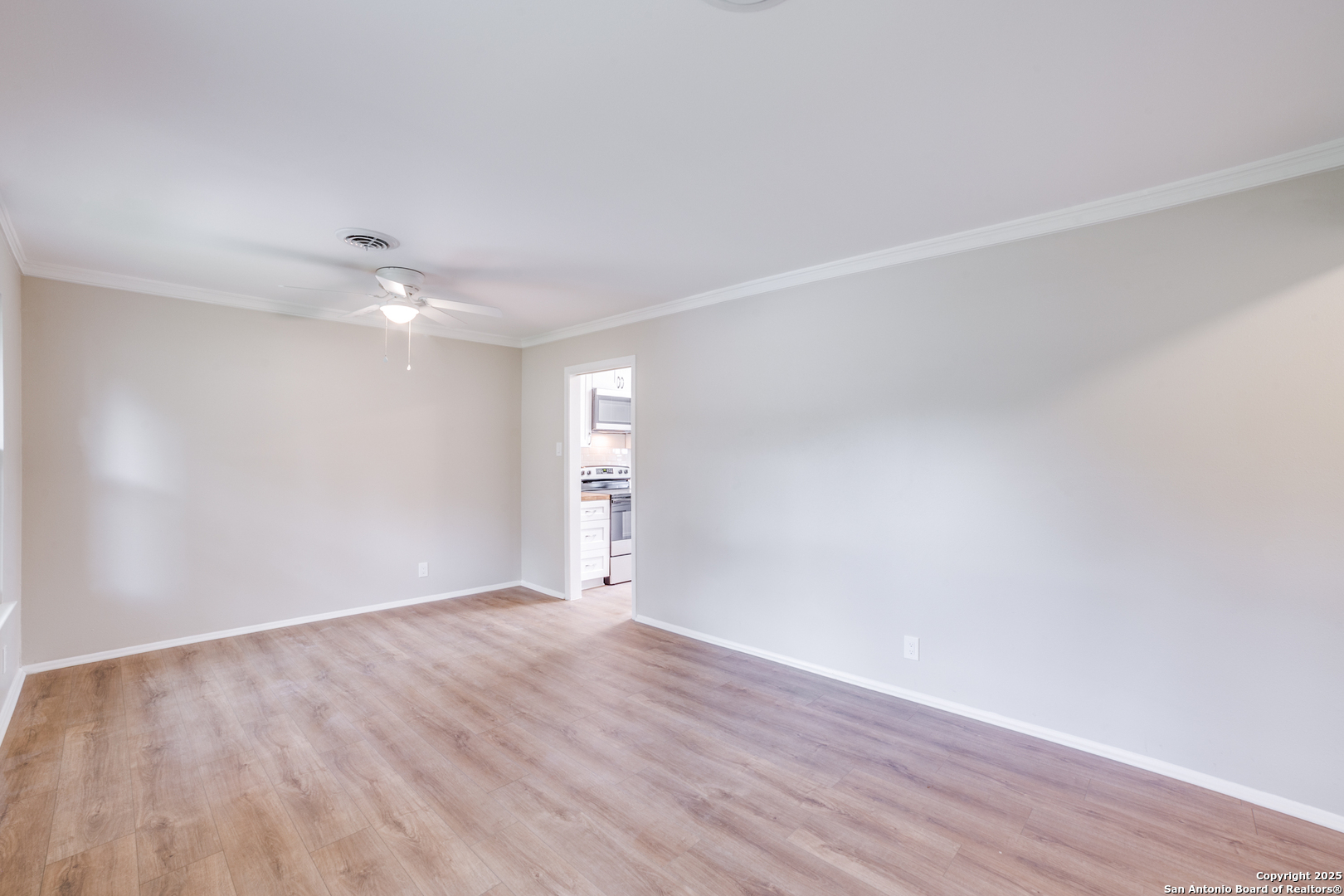 3323 Old Forge San Antonio, TX 78230 - Photo 9 of 26 a view of an empty room with wooden floor