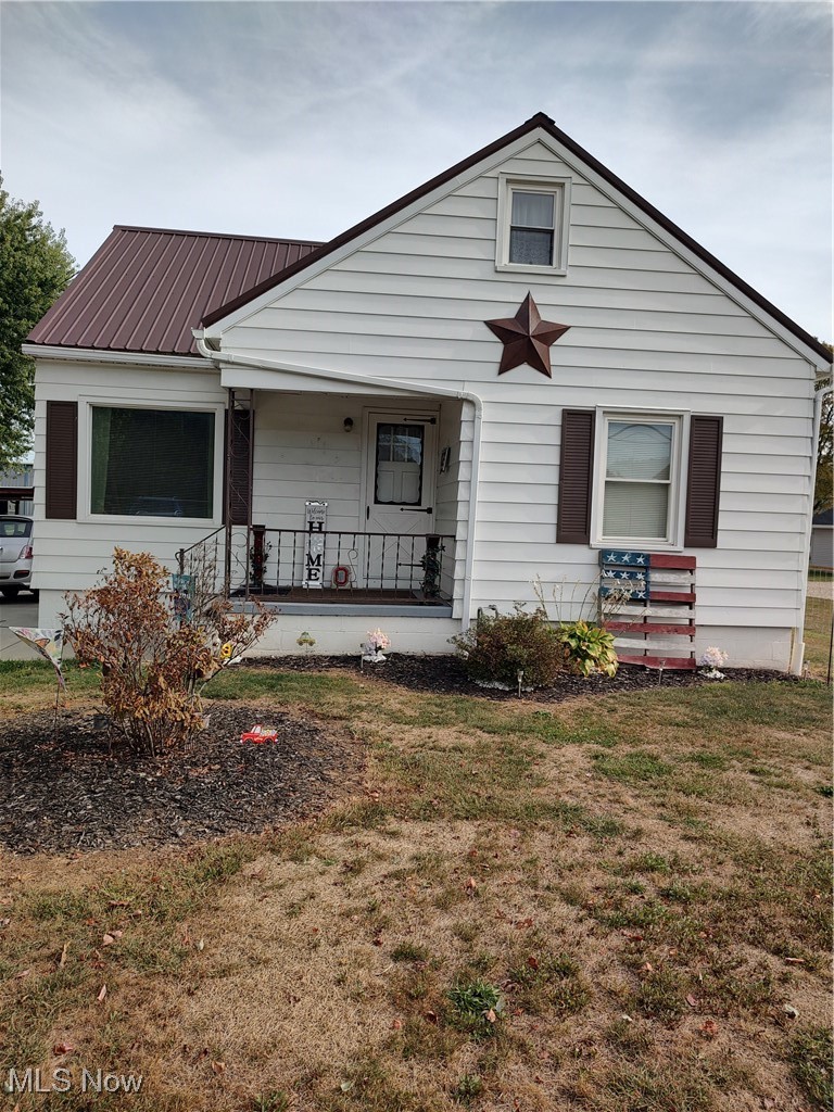 5434 East State Road Newcomerstown, OH 43832 - Photo 2 of 34 View of front of property with a front yard and a porch