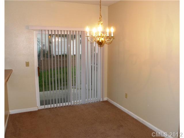 606 Stone Village Drive, Unit 606 Fort Mill, SC 29708 - Photo 5 of 11 a view of a chandelier in a room