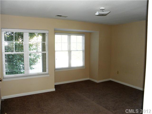 606 Stone Village Drive, Unit 606 Fort Mill, SC 29708 - Photo 6 of 11 an empty room with a window