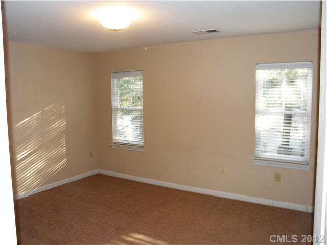 606 Stone Village Drive, Unit 606 Fort Mill, SC 29708 - Photo 7 of 11 an empty room with a window