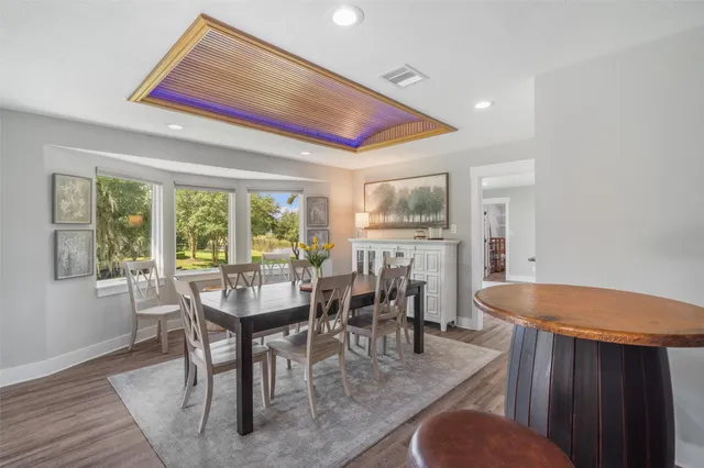 a dining room with furniture and window