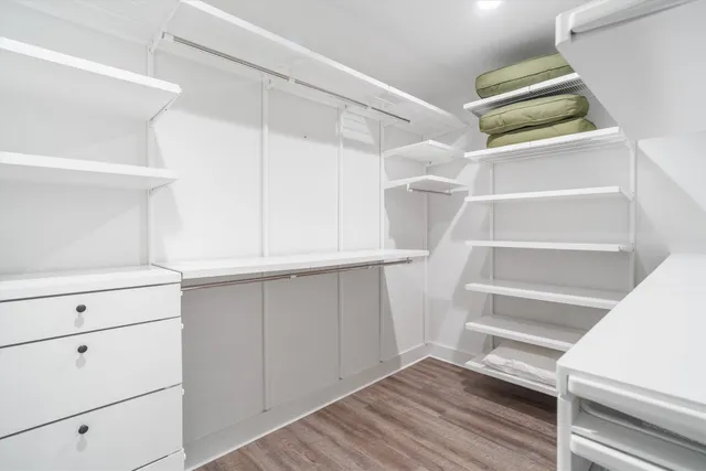 a bedroom with a bed and a table