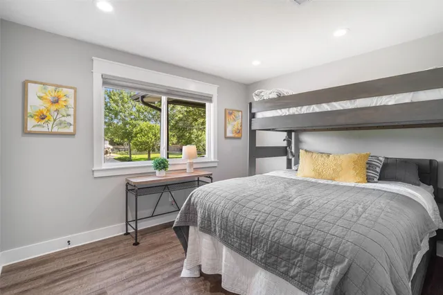 a bathroom with double vanity sink a toilet and a large mirror