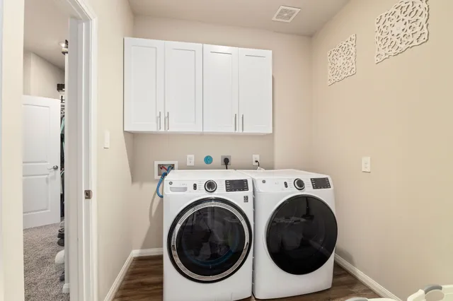 a utility room with dryer and washer