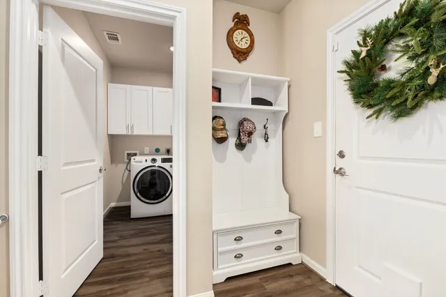 a bedroom with a bed and cabinets