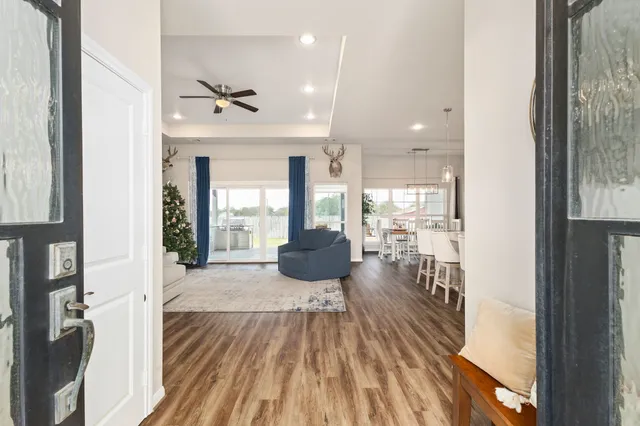 a view of a living room and a floor to ceiling window