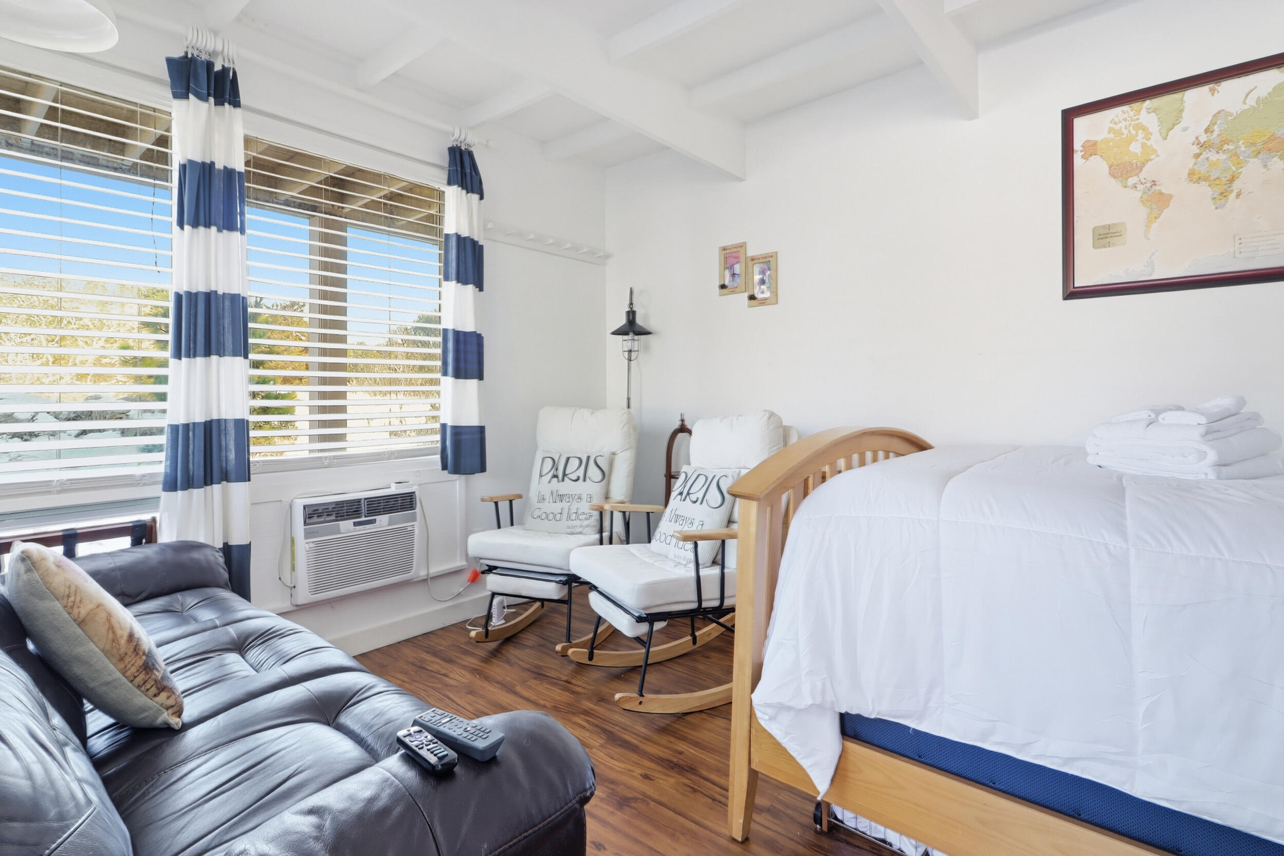 169 Shore Road, Unit 15 Truro, MA 02666 - Photo 2 of 12 a bedroom with a bed and a large window