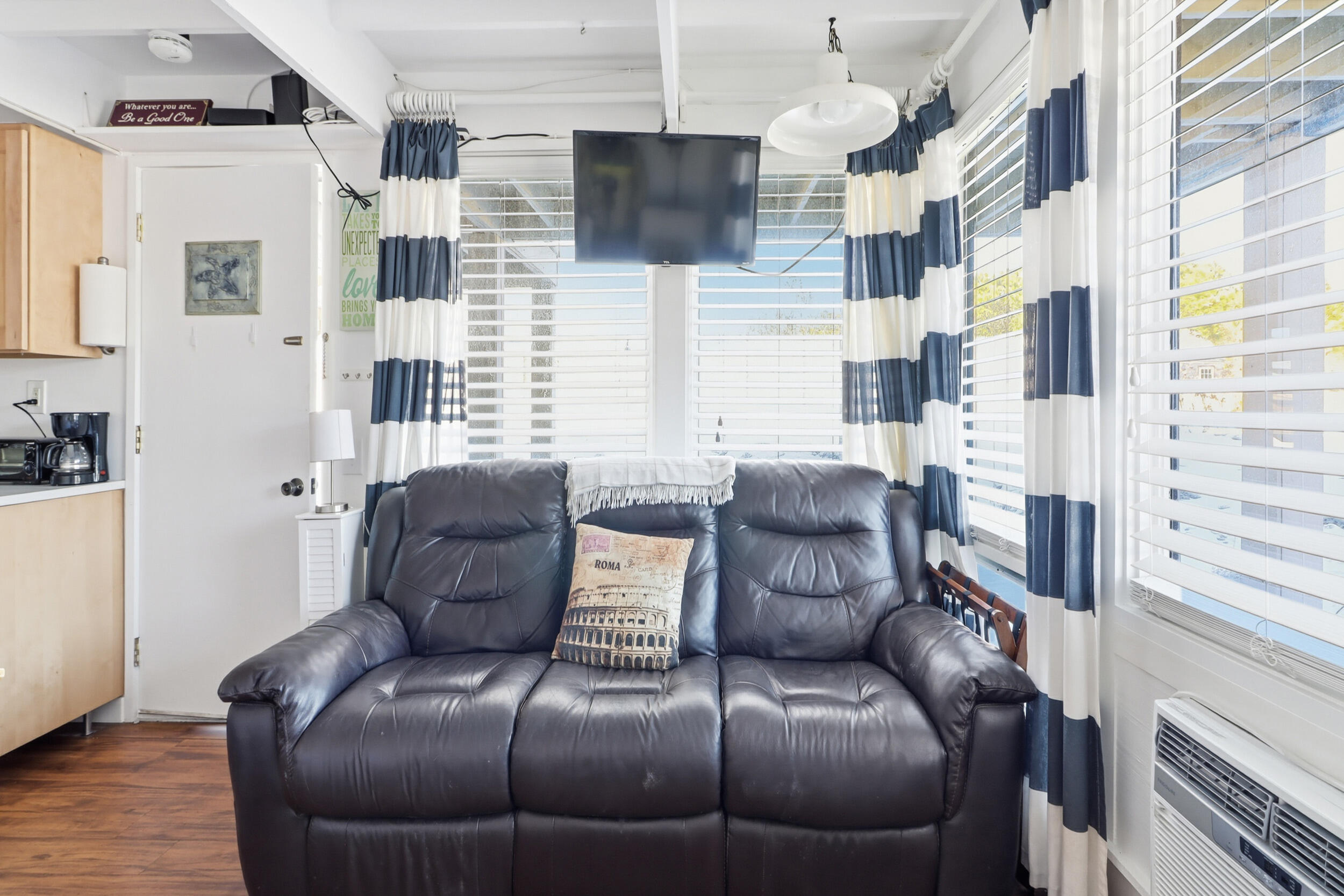 169 Shore Road, Unit 15 Truro, MA 02666 - Photo 4 of 12 a living room with furniture and a flat screen tv