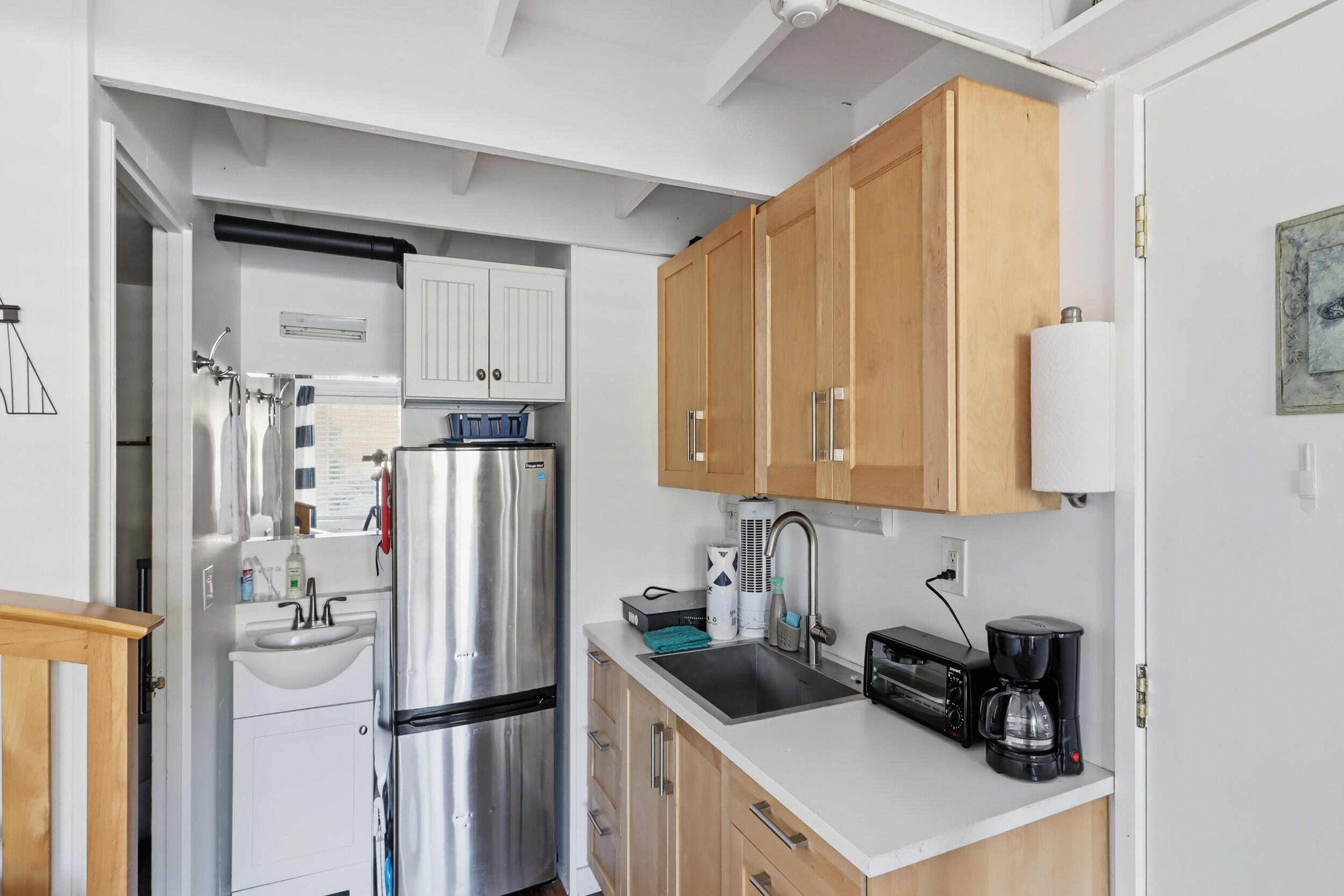 169 Shore Road, Unit 15 Truro, MA 02666 - Photo 6 of 12 a kitchen with stainless steel appliances granite countertop a refrigerator and a stove