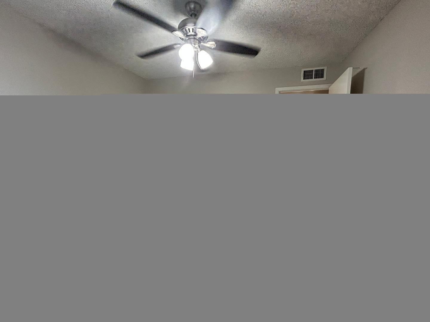 859 South Ext Road Mesa, AZ 85210 - Photo 13 of 19 a view of a livingroom with a ceiling fan and wooden floor