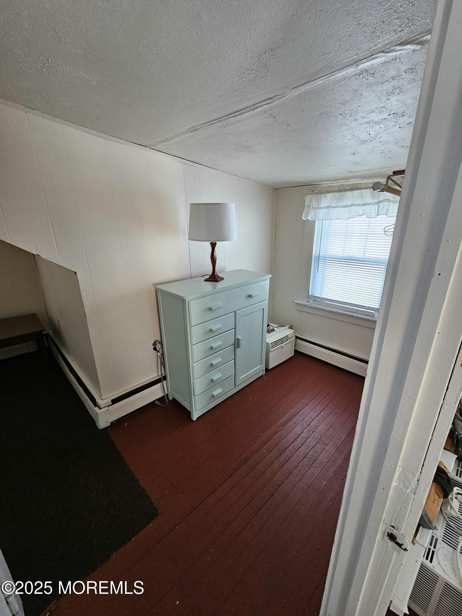 207 3rd Avenue, Unit REAR Belmar, NJ 07719 - Photo 9 of 13 a room with furniture and window