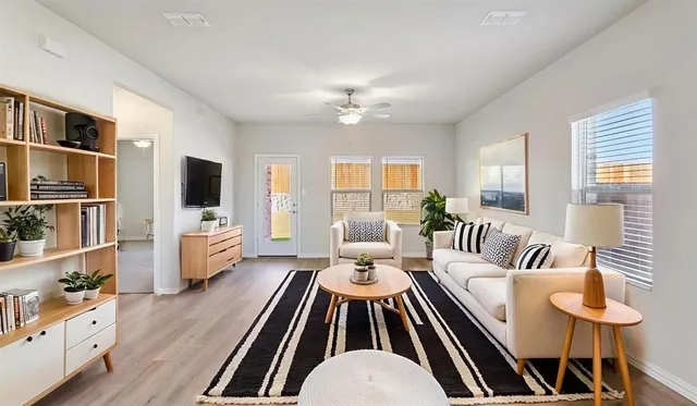 a living room with furniture fireplace and a flat screen tv
