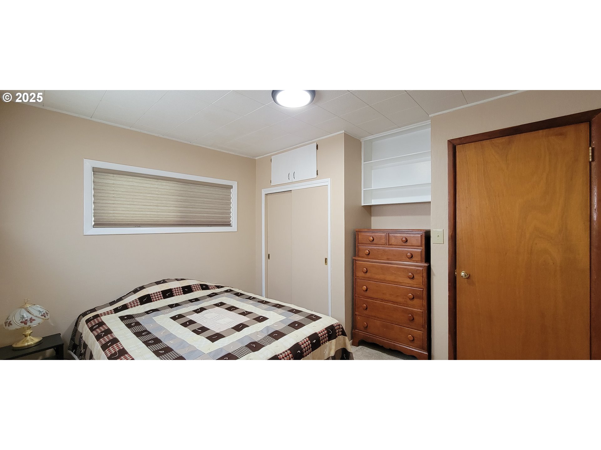 76376 River Road Oakridge, OR 97463 - Photo 21 of 38 a bedroom with a bed and a dresser