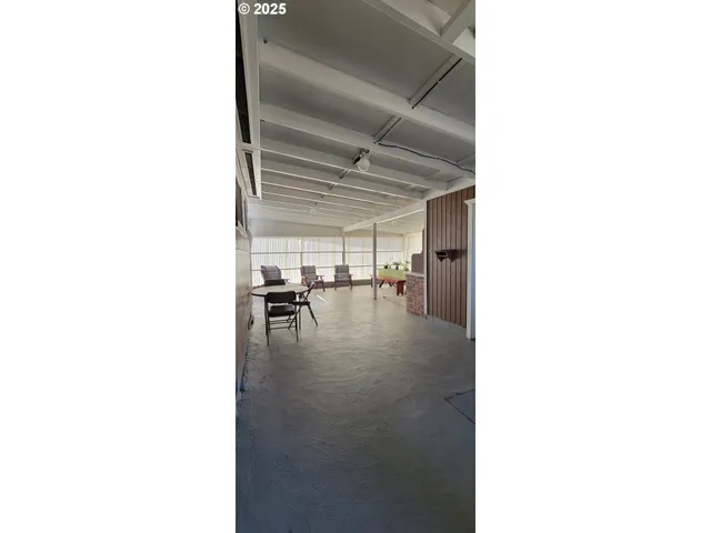 a kitchen with refrigerator and cabinets