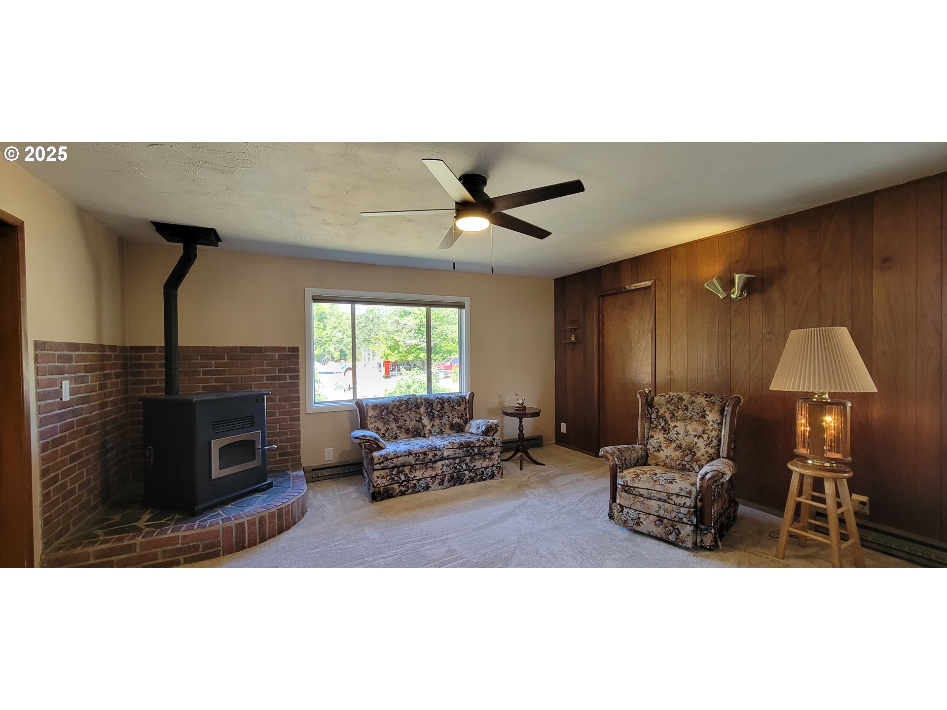 76376 River Road Oakridge, OR 97463 - Photo 10 of 38 a living room with furniture a fireplace and a flat screen tv