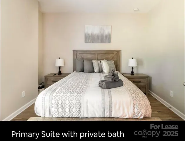 a bedroom with a bed and a night stand