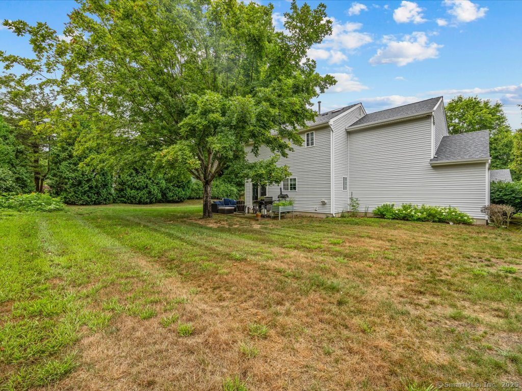 3 Apple Way Madison, CT 06443 - Photo 11 of 31 a view of a backyard with large trees