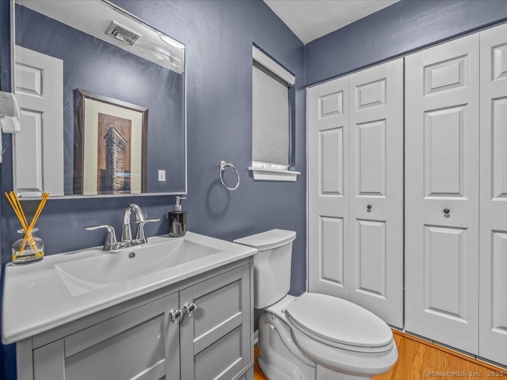 3 Apple Way Madison, CT 06443 - Photo 15 of 31 a bathroom with a sink a toilet a tub and a mirror