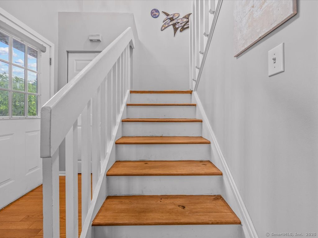 3 Apple Way Madison, CT 06443 - Photo 17 of 31 a view of staircase with white walls and white walls