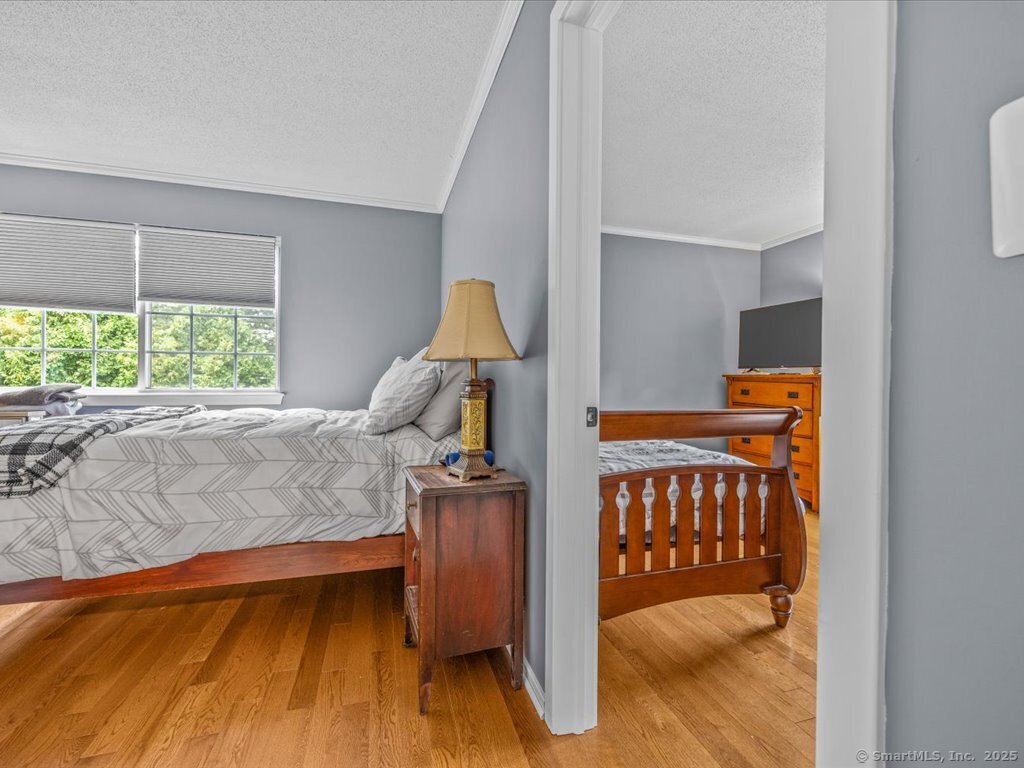 3 Apple Way Madison, CT 06443 - Photo 19 of 31 a view of a bedroom with furniture and staircase